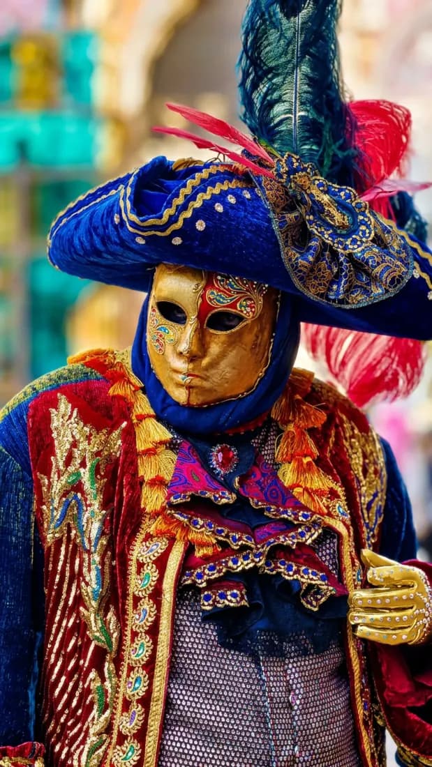 A Venetian carnival performer's ornate mask costume is brought to life in vivid color by the Image Colorizer tool.