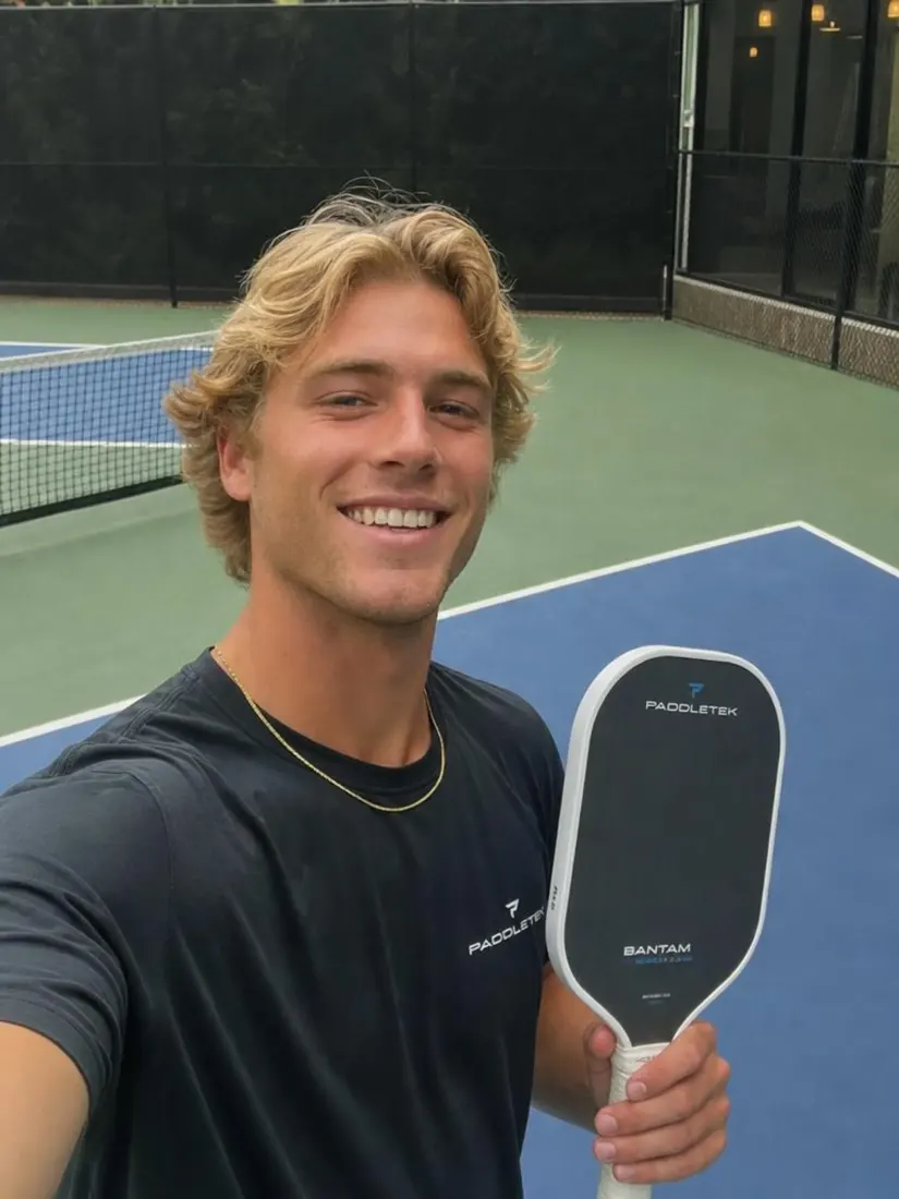 A blond man holds a pickleball paddle on a court, before the Movie Poster Generator casts him in an action poster.