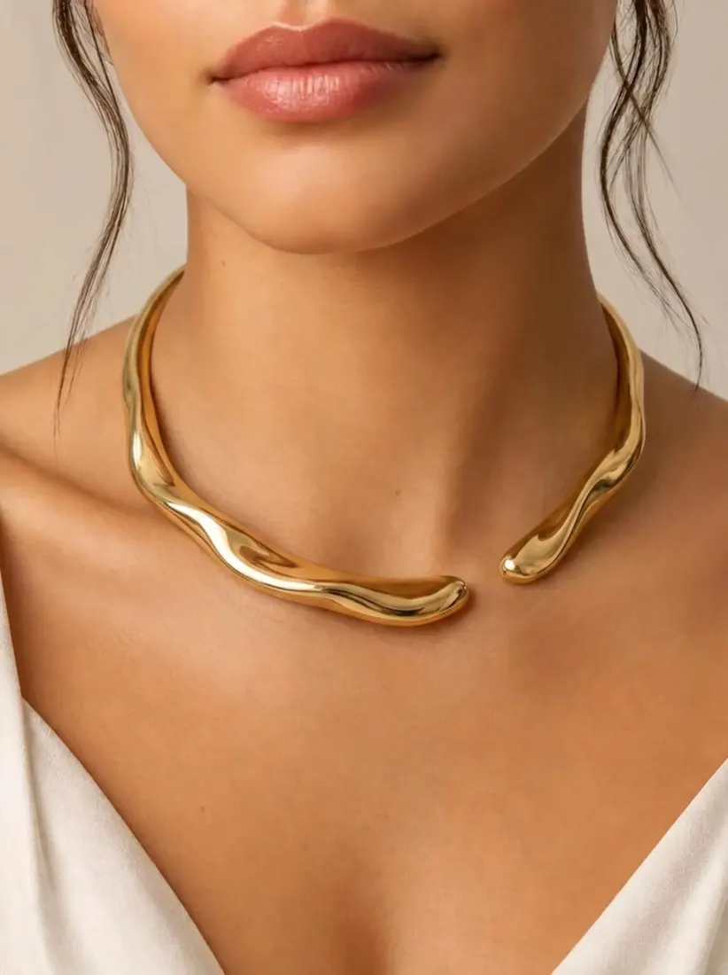 A close-up of a collarbone shows a chunky gold statement necklace added by the Necklace Generator tool.