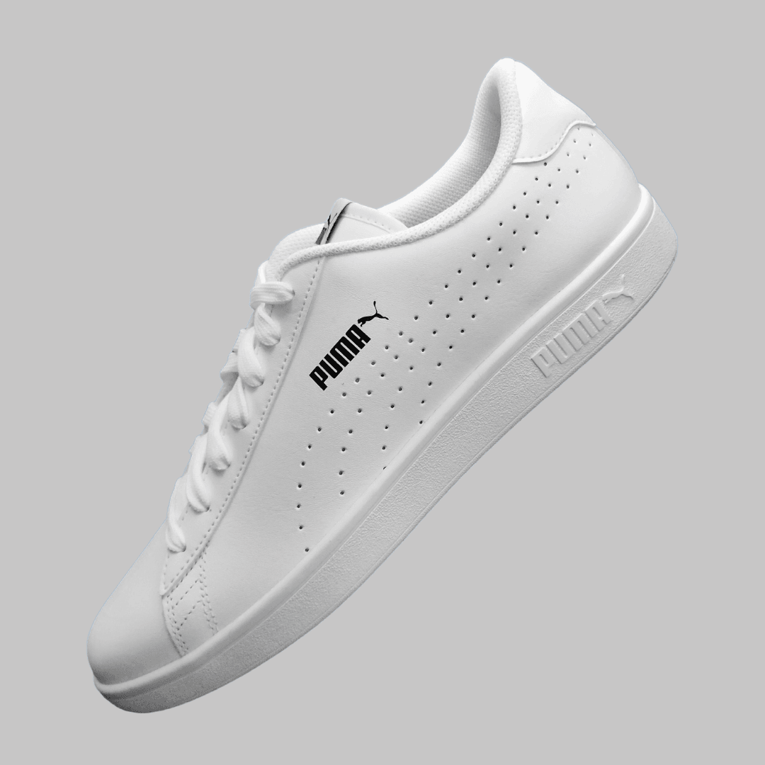 A Puma product photo on a gray background, created with the Background Changer.